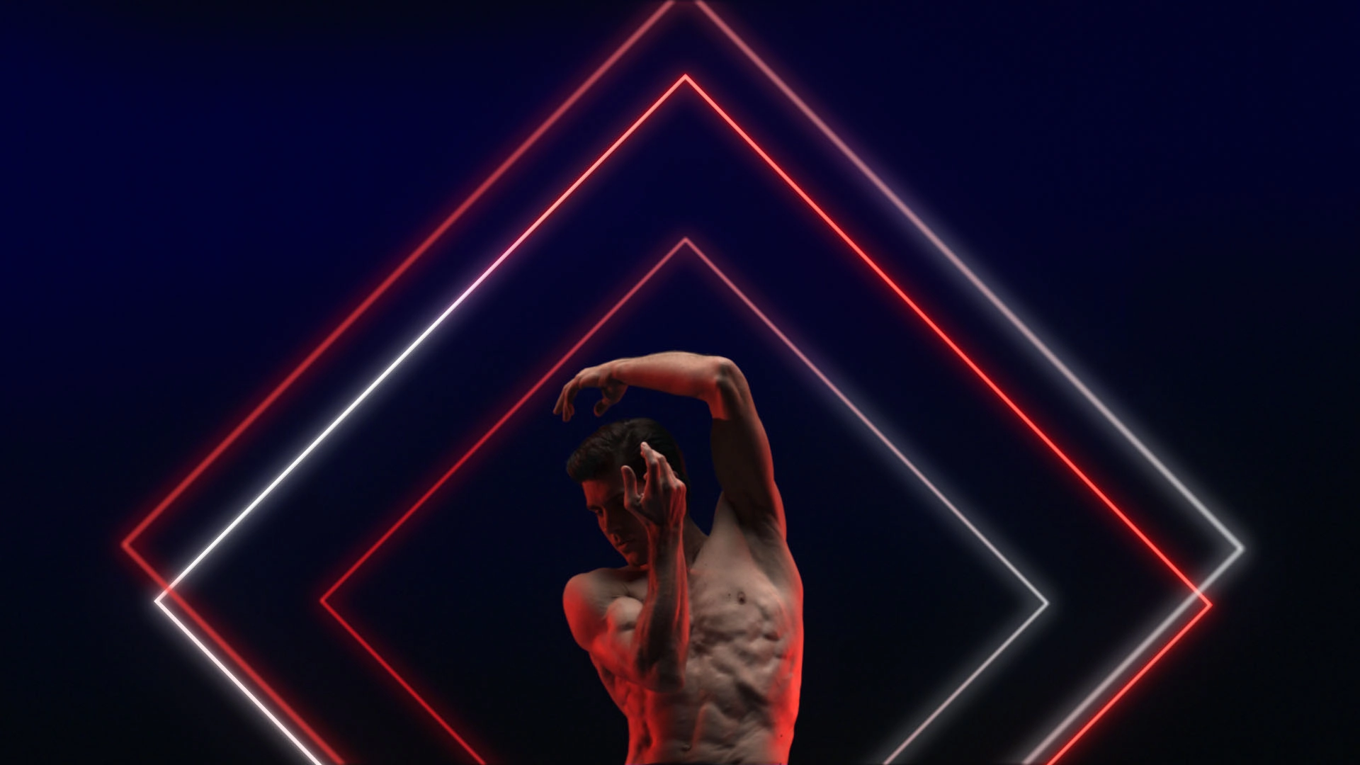 Dancer positioned against neon light installation